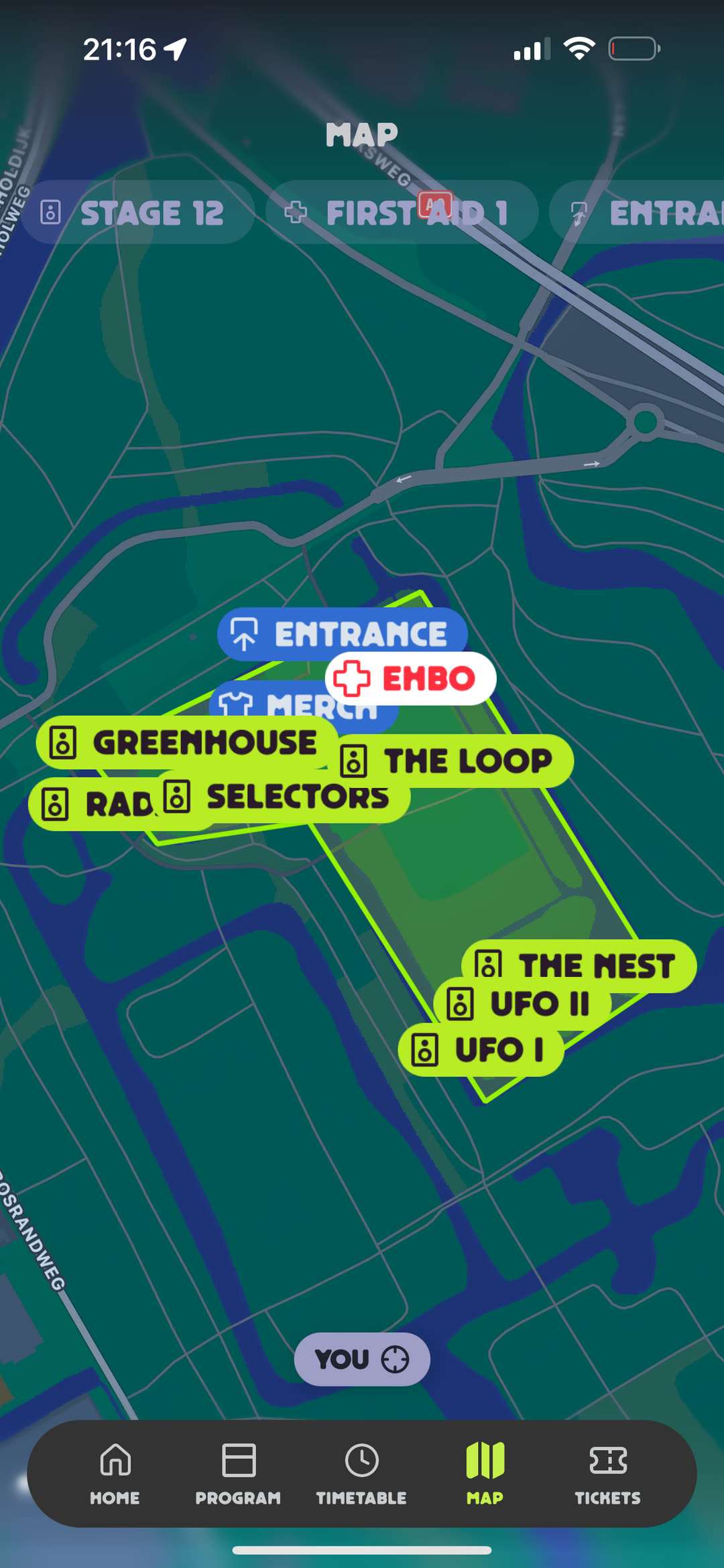 Festival site map with stage, first aid, and entrance markers